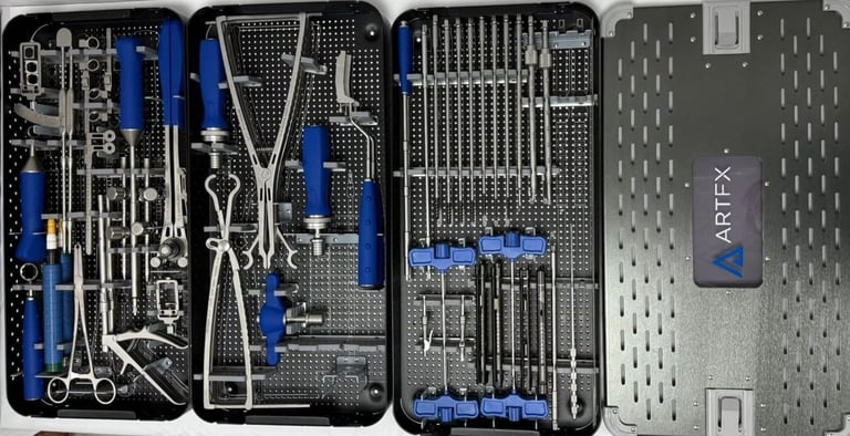 Multiple organized toolboxes with surgical instruments, wrenches, and blue-handled tools neatly arranged in foam cases