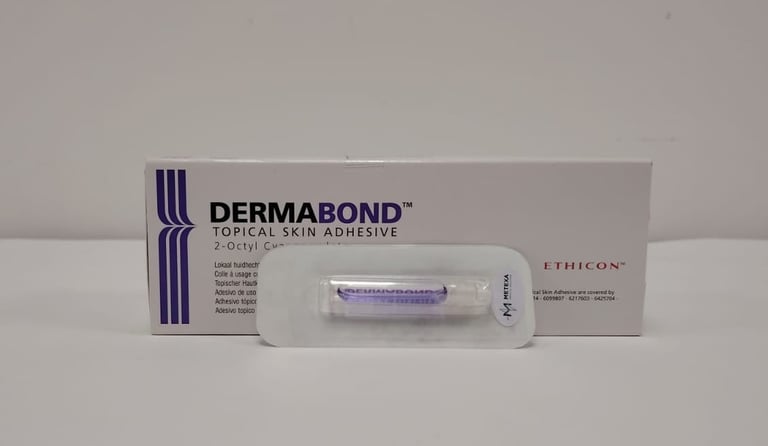 Dermabond topical skin adhesive product packaging with three boxes and a bottle displayed against a neutral background